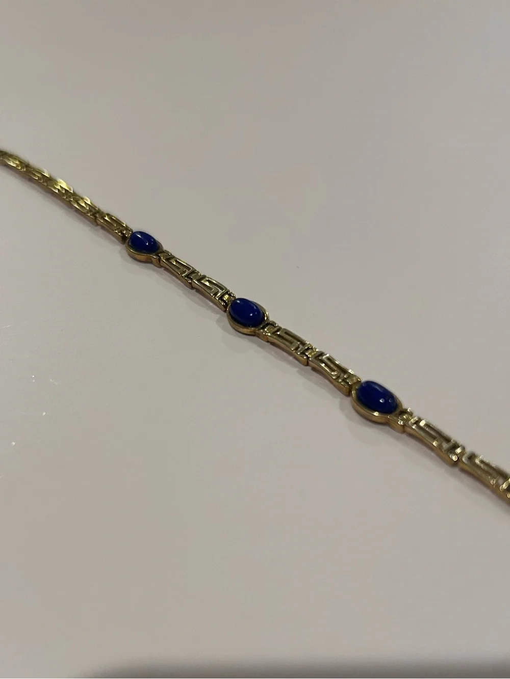 Gold Bracelet with Blue Stone Accents
